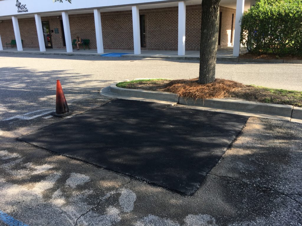 Asphalt repair in a parking lot by Rick Oakes Contracting