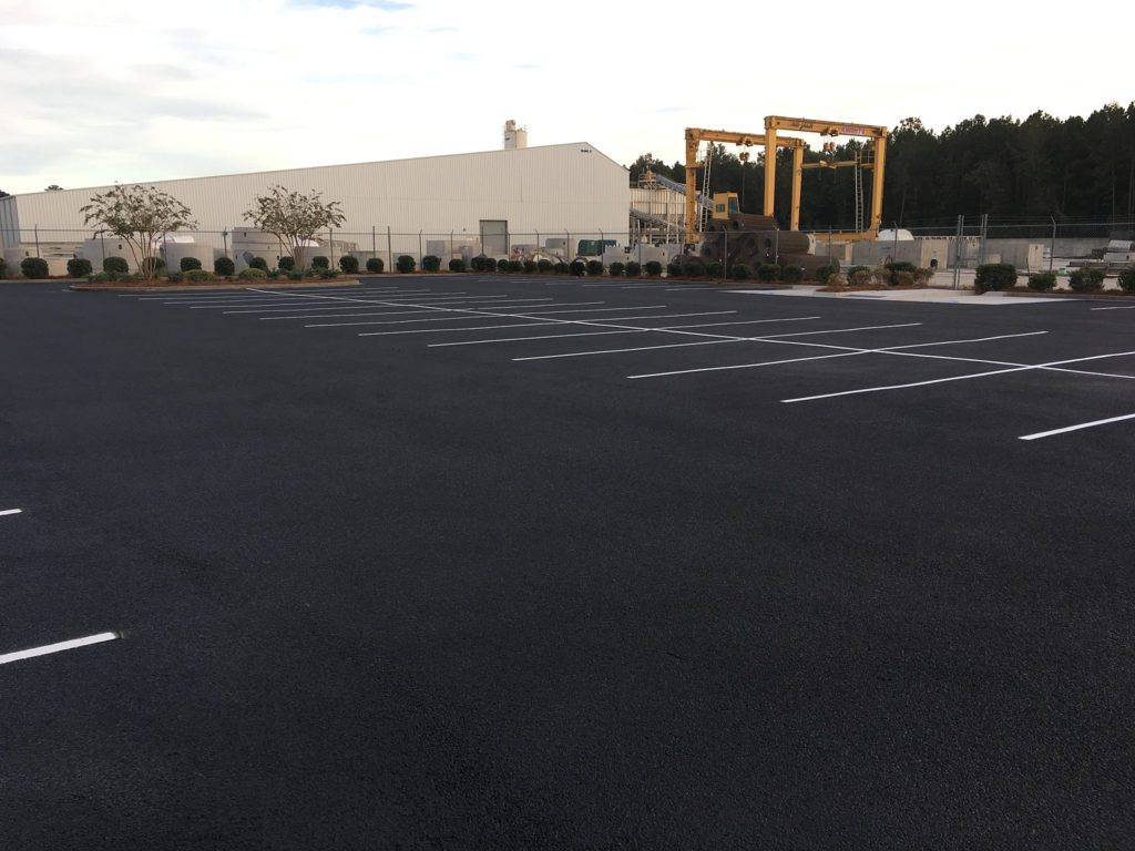 Asphalt repair and sealcoating with white line striping