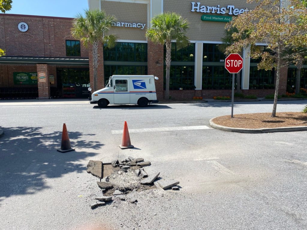 pothole in a parking lot